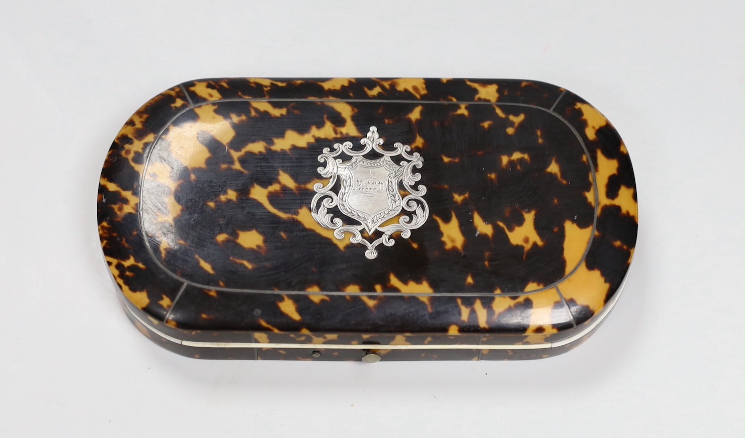 A Victorian tortoiseshell cased necessaire set, containing mother-of-pearl and steel tools, silver thimble and propelling pencil with ivory edging